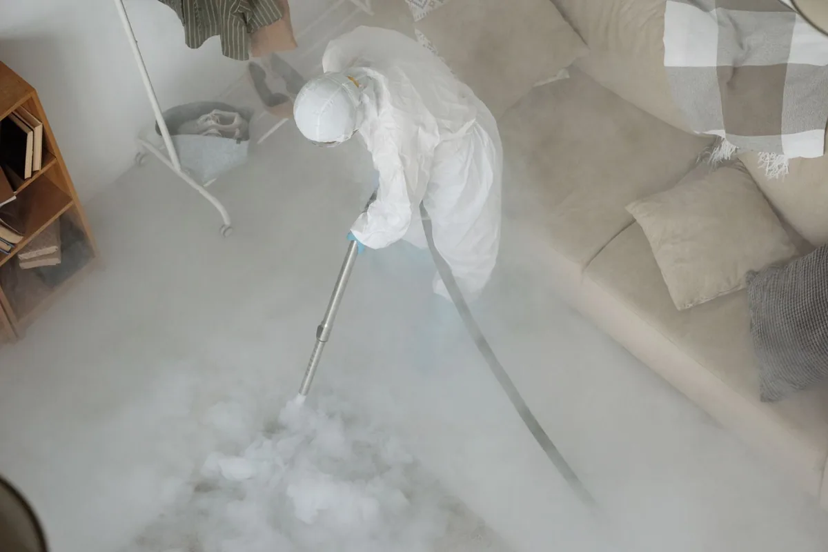 Biohazard cleanup technician in protective equipment, Social Circle, GA